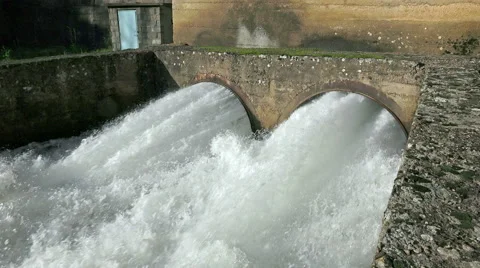 4k high flood waters are being released through the dam. steadycam uhd stock Stock Footage 45345755