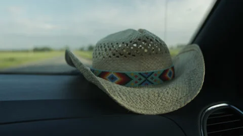 4K High Quality Cowboy hat on car dashboard Prores 444 (Color Corrected) Stock Footage 138555573