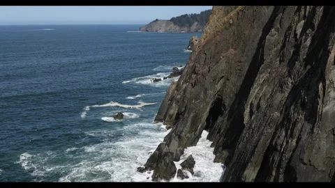 4K high quality footage of rugged cliffs over Pacific Ocean in Oregon Coast, USA Stock Footage 335763672