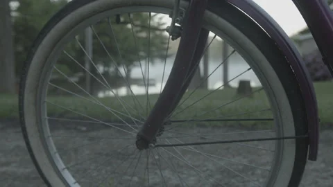 4K High Quality Rack focus bike spokes to a lake at dawn (Prores 444 LOG color) Stock Footage 137716915