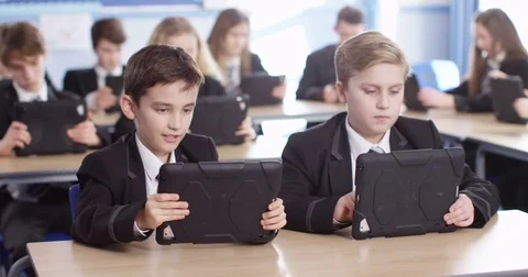 4k, High school children using digital tablets while sitting in class. Stock Footage 73276763
