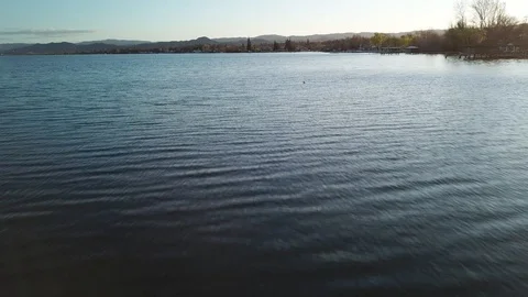4K High-speed, low-level drone flight over water; drone climbs at end Stock-Footage 114499895