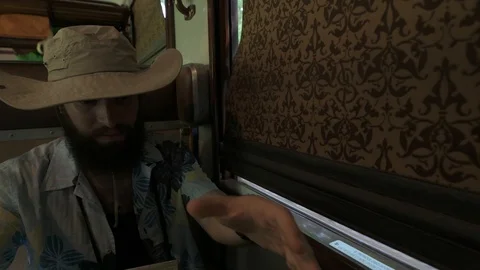 4K hipster checking map travelling on vintage train Stock Footage 90814190