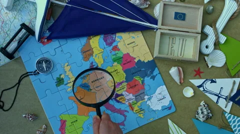 4k holiday and map  composition - travel to EU with magnifying glass 스톡 동영상 64235456