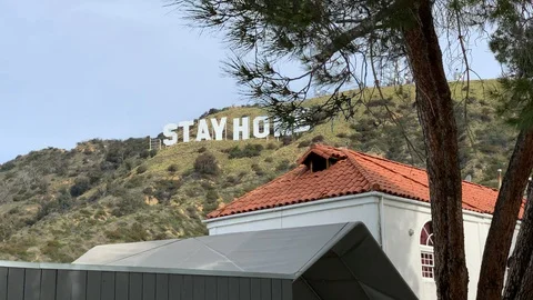 4K Hollywood sign of STAYHOME Covid 19 Stock Footage