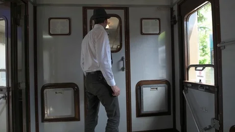 4K horizontal pan of passenger worried about the train suddenly stopping Stock Footage 90808428