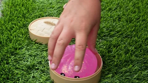 4K horizontal video of a child's hands squeezing a dumpling squishy Stock Footage 342078905