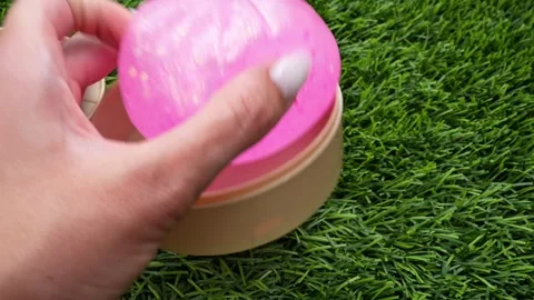 4K horizontal video of a hand squeezing a pink dumpling Stock Footage 342077516