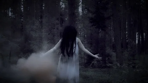 4K Horror Woman Gesturing in Forest with... | Stock Video | Pond5