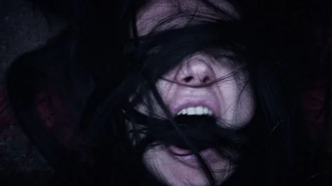 4k Horror Woman Screaming with Hairs in Mouth, edited Stock Footage