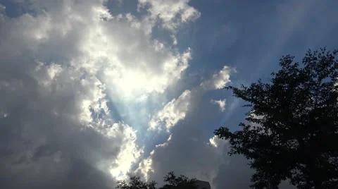 4K The Hot Sun Shining Through White Clouds In The Blue Sky-Dan Stock Footage 66686822