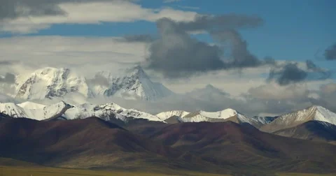 4k huge clouds mass rolling over Tibet snow-Covered mountains. Stock Footage 45608691