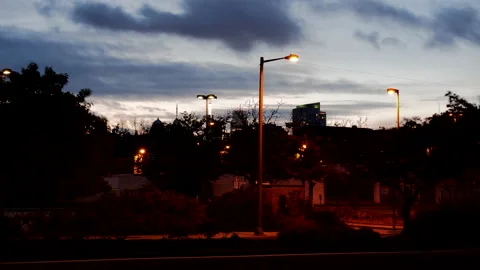 4K HYPER TIME LAPSE OF HIGHWAY WITH CLOUDS PASSING DURING DUSK Stock Footage 132074391