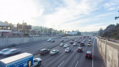 4K hyperlape of freeway traffic from day to night Stock Footage 70687620