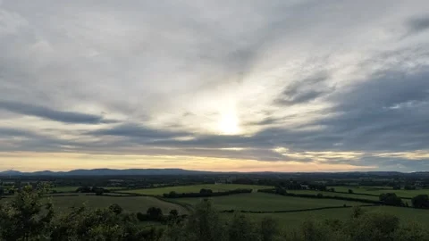 4K Hyperlapse of Dramatic Cloudy Sky Above Rural Farmland 库存影片 338307200