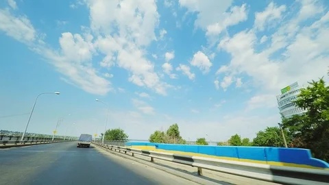 4K Hyperlapse drive over a bridge over a wide river with a planting and with Stock Footage 117042335