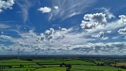 4K Hyperlapse Over Green Farmland Under Cloud Filled Sky Stock Footage 337398420