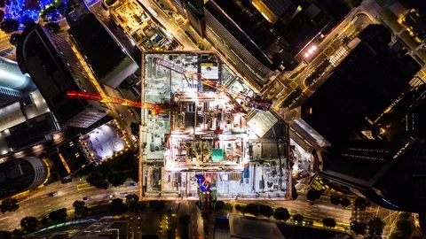 4K hyperlapse time-lapse of under construction site, crane, and car traffic Stock Footage 124923894