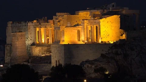 4K Illuminated Propylea temple in Acropolis museum Athens city landmark by night Stock Footage 70702268
