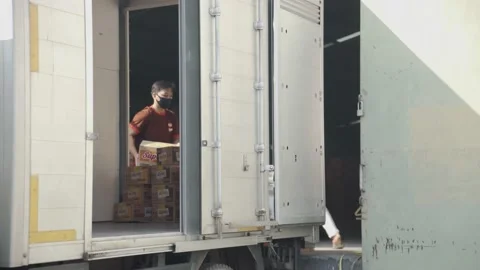 4K Industrial Warehouse Workers Loading Goods into Trucks Stock Footage 157166852