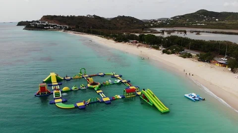4k Inflatable boy games in the ocean aerial shot in antigua island Stock-Footage 111312483