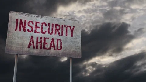 4K Insecurity Ahead Warning Rusty Sign under Clouds Timelapse Stock Footage 77565578