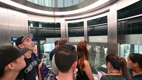 4K Inside elevator with tourist from 75th floor to rooftop Stock Footage 98773644
