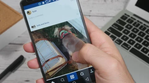 4K Instagram App On Smartphone Screen Office Desk Background 스톡 동영상 56941514
