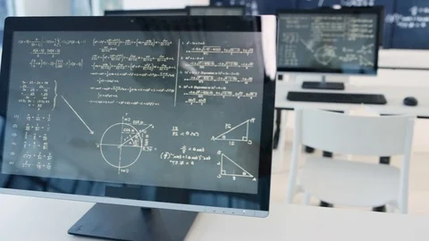 4K Interior of empty classroom with computers &amp; math formulas on blackboard Stock Footage 73188655