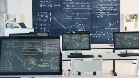 4K Interior of empty classroom with computers &amp; math formulas on blackboard Stock Footage 73190327