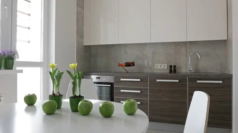 4K. Interior of modern kitchen in scandinavian style. Motion view with apples. Stock Footage 73580756