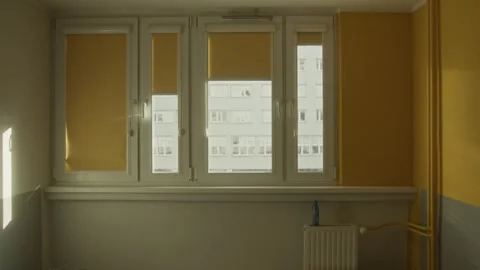 4K Interior Shot of Dorm Room Window with Sunlight and partially closed blinds Stock Footage 307136279