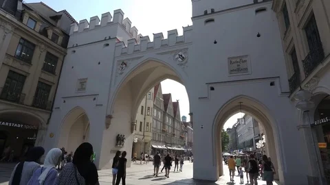 4K Islamic Arab tourists passing Karlstor City Gate Karlsplatz shopping Munich Stock Footage