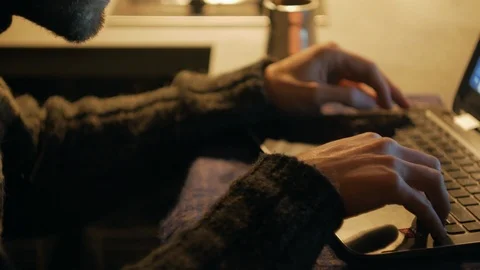 4k IT programmer develops application on laptop at warm light room at home close Stock Footage 86378477