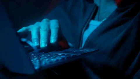 4k IT programmer works at home in dark room with laptop and develops software  動画素材 88028531