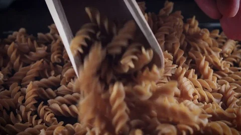 4k Italian Pasta Whole Wheat Fusilli in Scoop Stock Footage