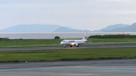 4K JAL Embraer E170 JA211J Taking Off at Matsuyama Airport Japan Stock Footage 336248285