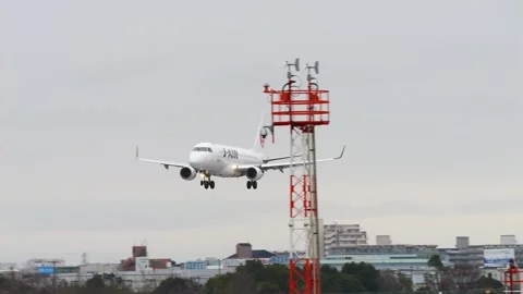 4K JAL Embraer E170 JA211J Landing at Osaka Itami Airport Japan Stock Footage 337116084