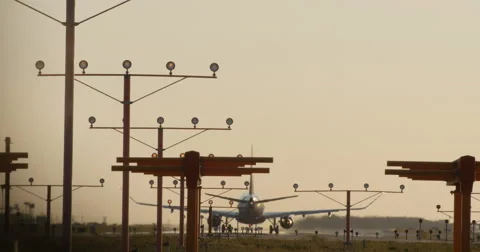 4K JET TAKES OFF DOWN RUNWAY Stock Footage 64144675