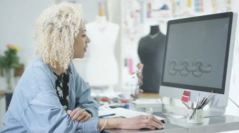 4K Jewelry designer working on computer checking designs with software program.  Stock Footage 63999485