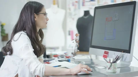 4K Jewelry designer working on computer checking designs with software program.  Stock Footage 64026264