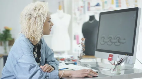 4K Jewelry designer working on computer checking designs with software program.  Stock Footage 64035671