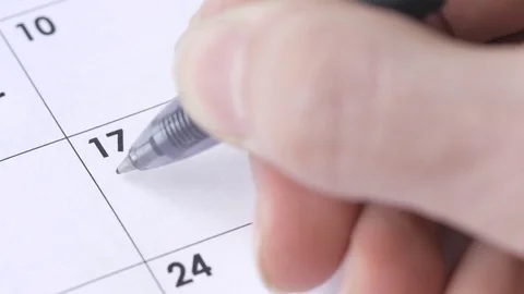 4K Job Interview Writing in Schedule Calendar Date Stock Footage 74131393