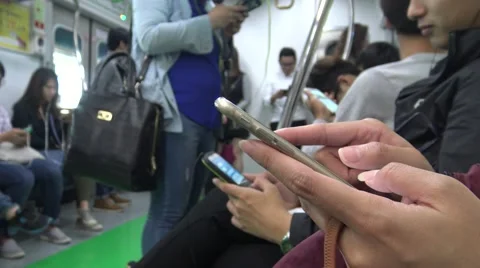 4K Korean people using smartphone in subway sit down and play phone in Korea-Dan Stock Footage 57720168
