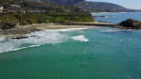 4K Laguna Beach - Orbiting Surfers Stock Footage 72935224