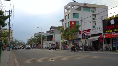 4k Lai Thieu (close Saigon), Vietnam: Street traffic at noon Stock Footage 231333081
