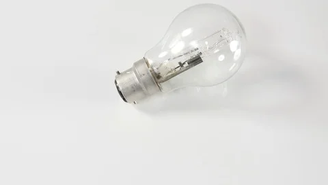 4k lamp Light bulb moving against white background Stock Footage 90190880