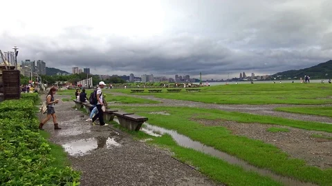 4K Landscape people walking in riverside park Tamsui river, cloudy weather-Dan Stock Footage 73588672