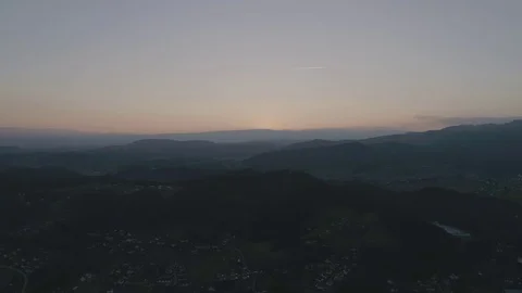 4K, Landscape with a small orange sun before disappearing over the horizon Stock Footage 73128718