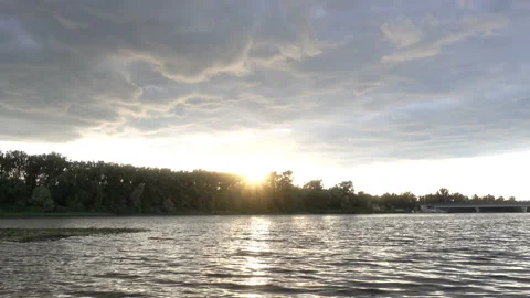 4K landscape view of river, forest and cloudy sky at sunset. Stock Footage 135418117